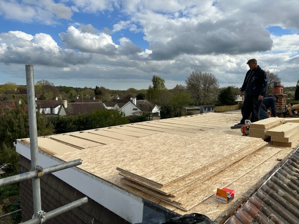 Roofer installing roof decking